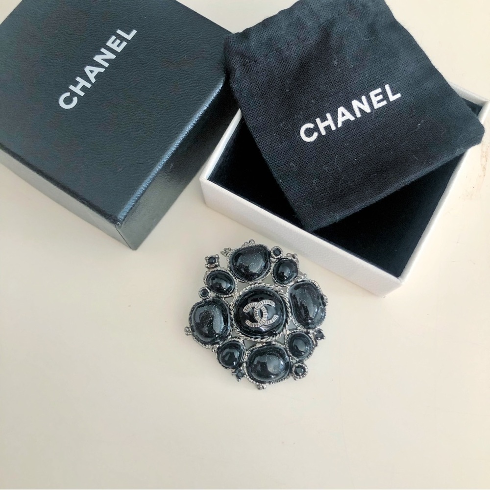 CHANEL Black Camellia Brooch - Signature Logo Accent